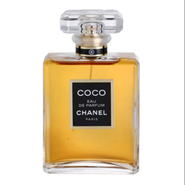 chanel coco eau de perfume with amber colored fragrance in a clear bottle with black and gold accents