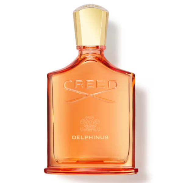 creed delphinus eau de perfume bottle in orange glass with gold tone cap