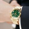 rolex oyster perpetual day date yellow gold with a green dial