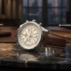 breitling watch with a silver dial and brown leather strap breitling watch with a silver dial and brown leather strap