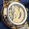 rado watch with a black and gold design and a skeleton dial rado watch with a black and gold design and a skeleton dial
